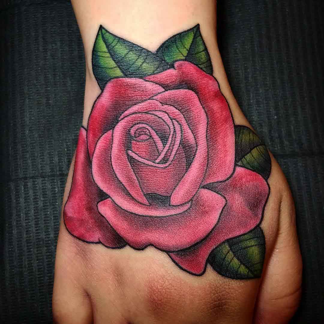 pink rose tattoo on hand