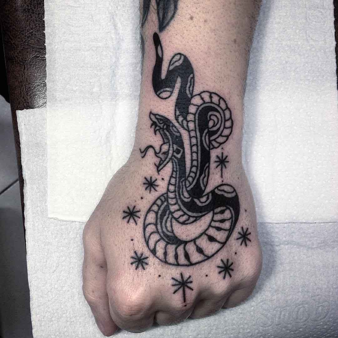 hand tattoo snake with stars