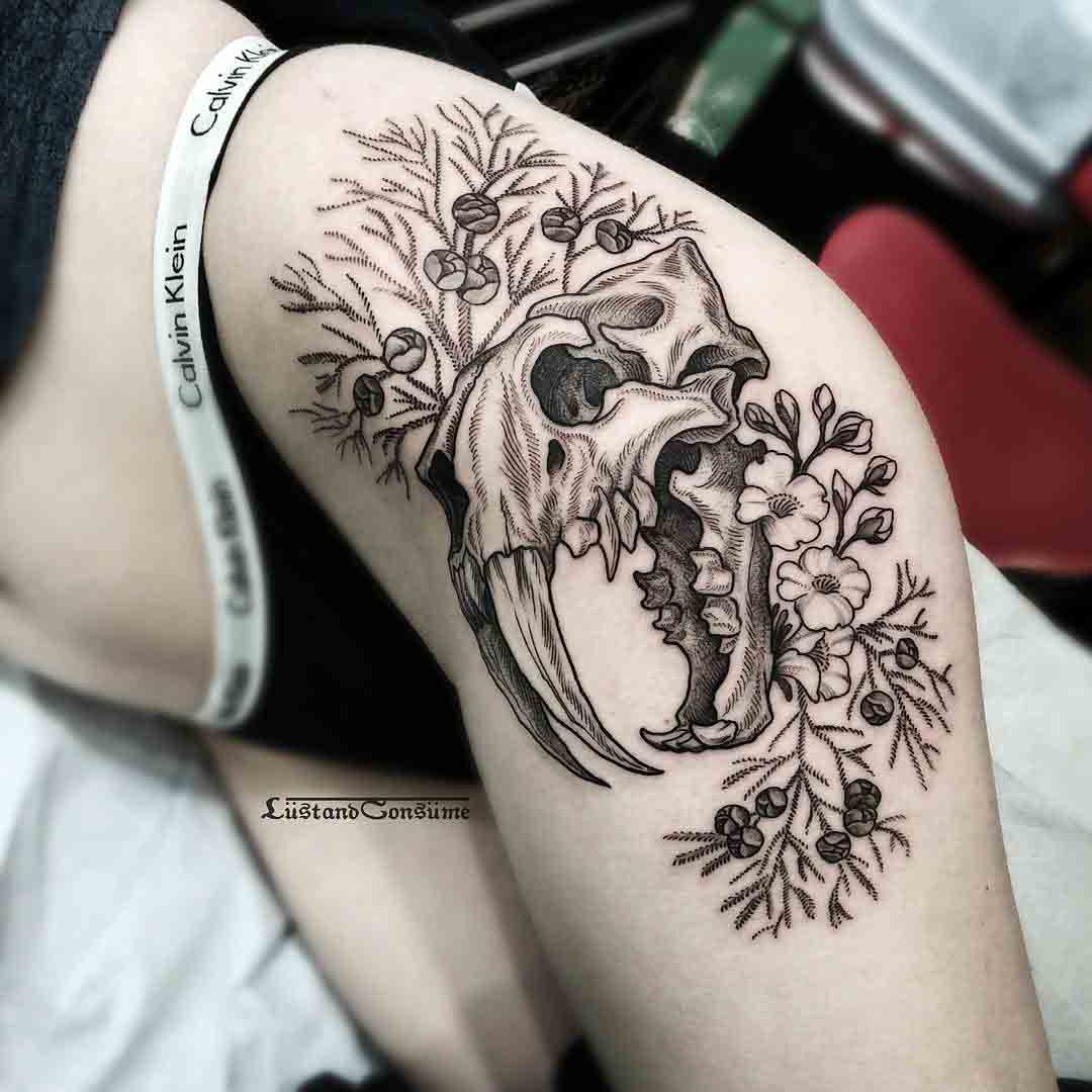 cat skull tattoo on hip girl