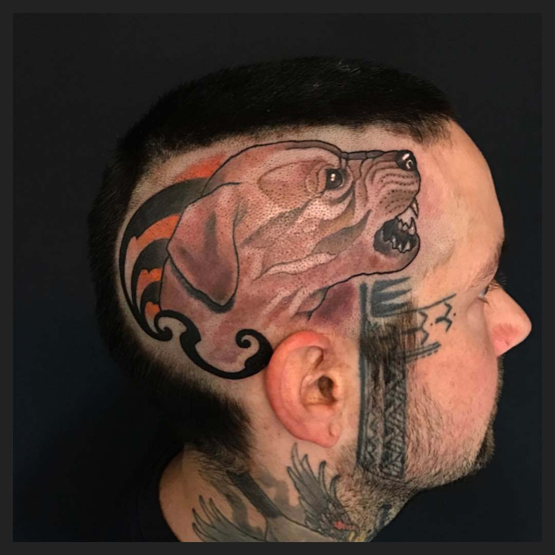 dog tattoo on head side