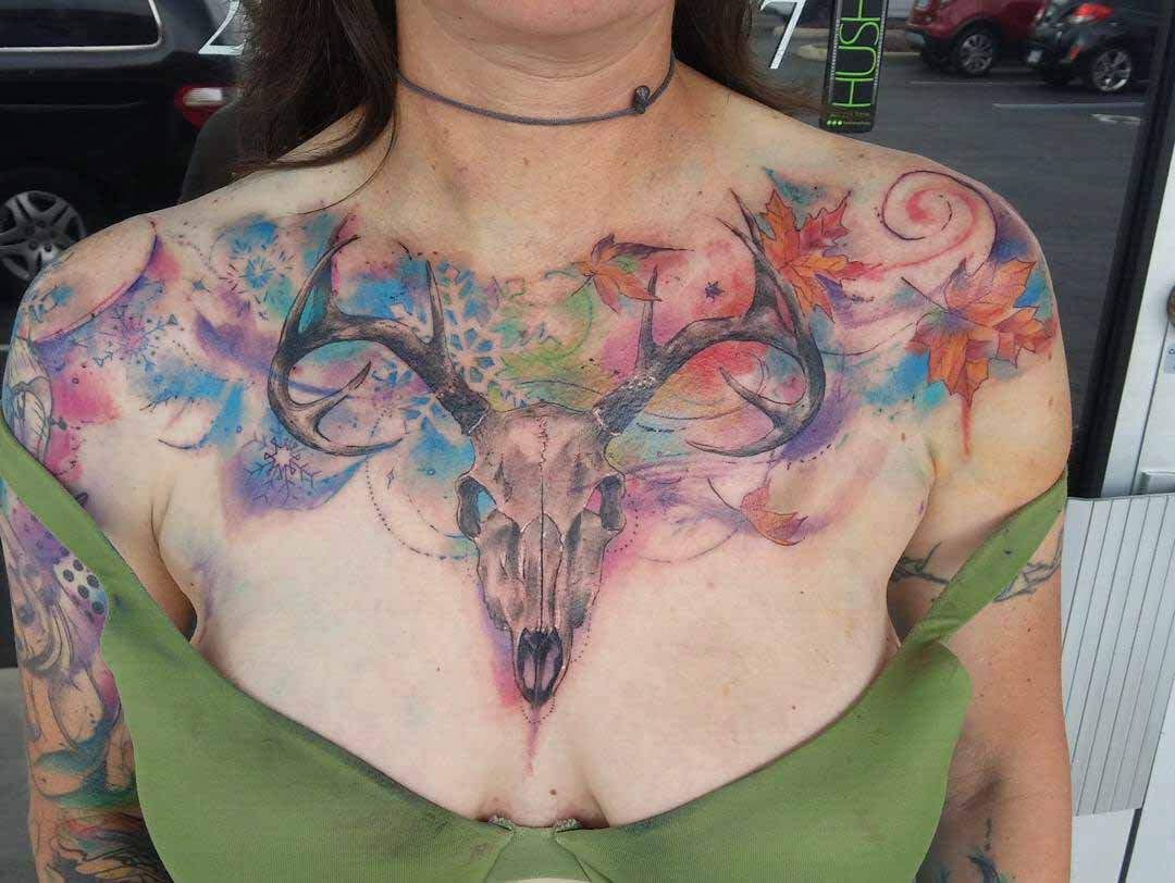 ram skull watercolor tattoo on chest