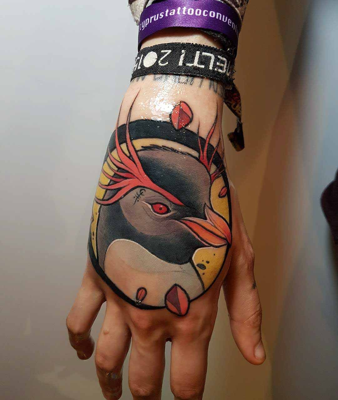 penguin tattoo on hand neo-traditional style