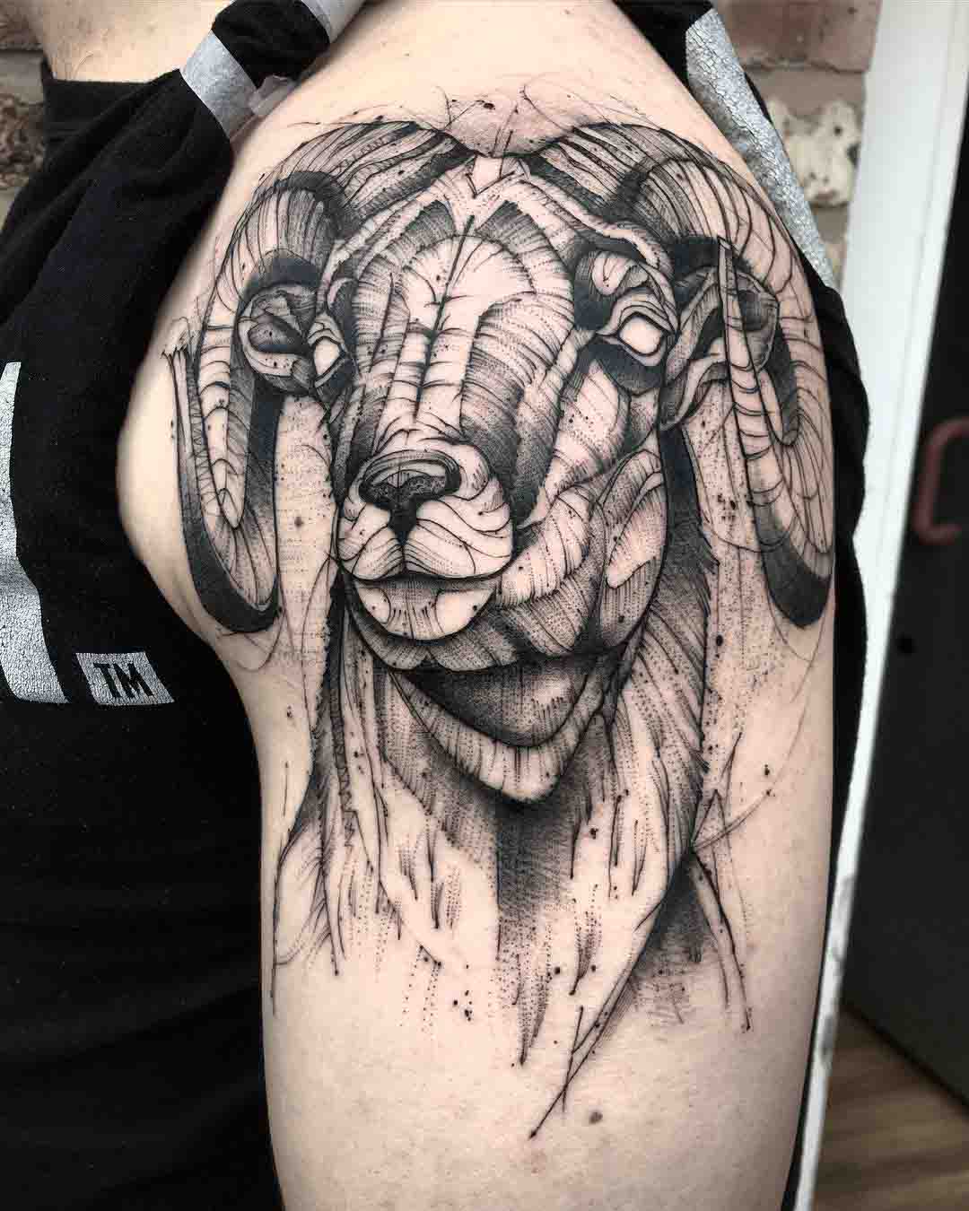 black and grey ram tattoo on shoulder