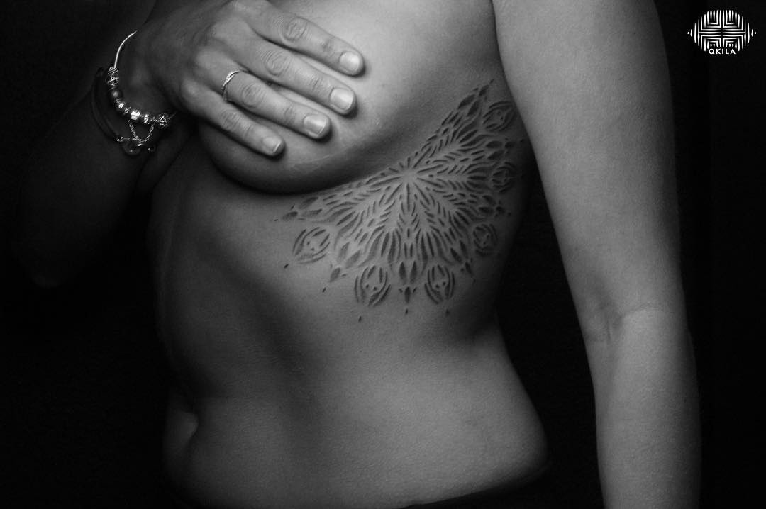 mandala tattoo on side of breast