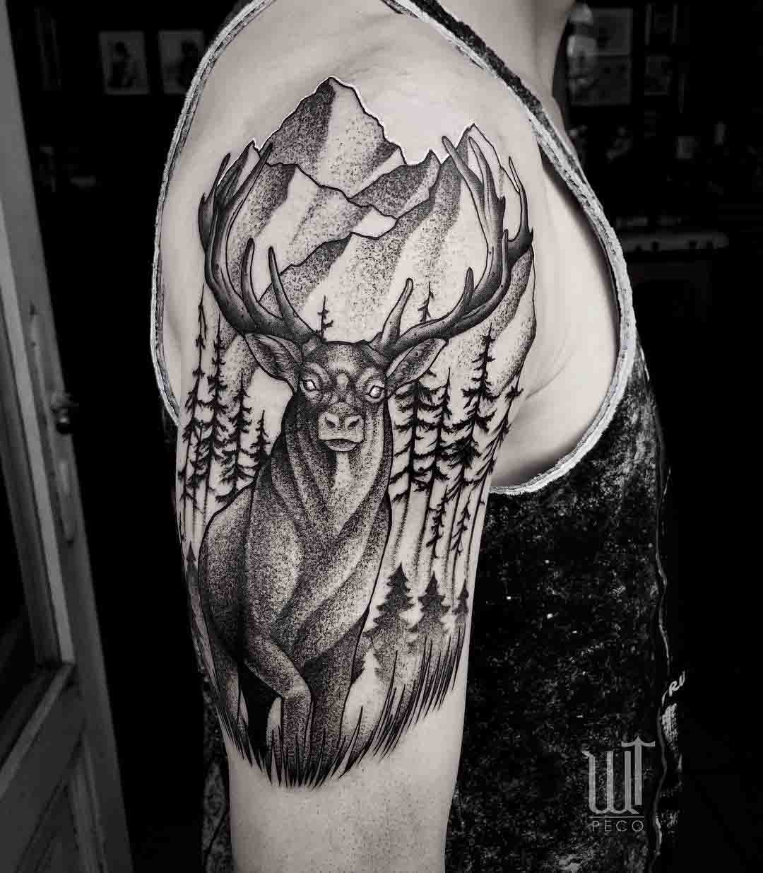 mountain stag tattoo on shoulder