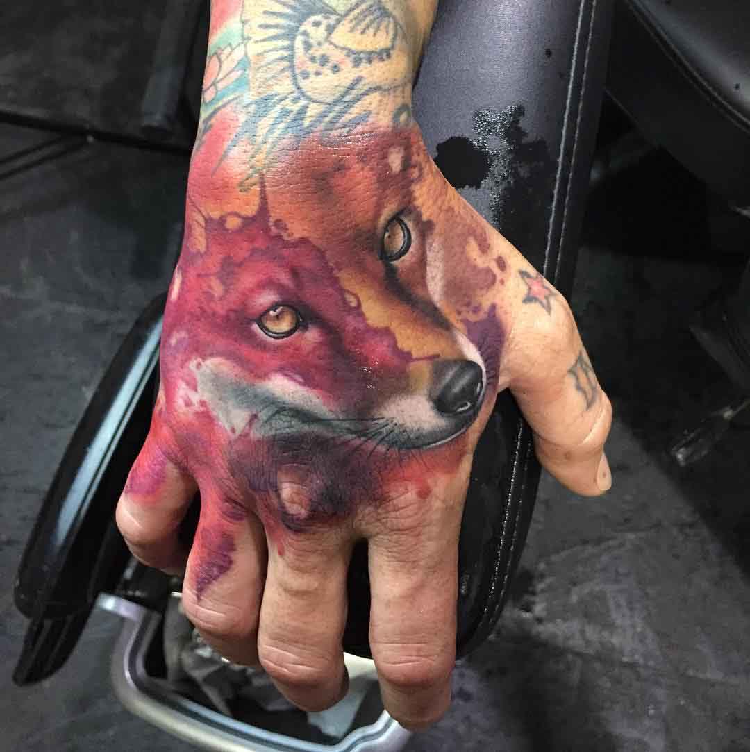 watercolor fox tattoo on hand