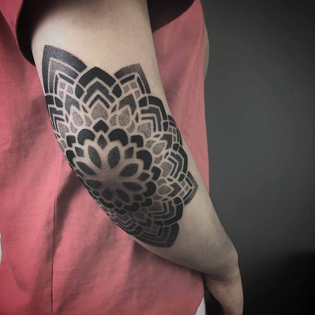 dotwork mandala tattoo on elbow
