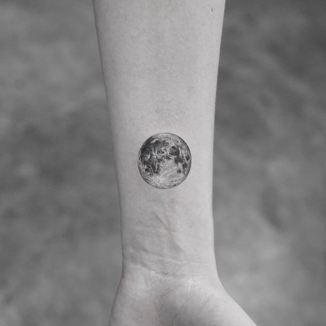 small tattoo moon on wrist