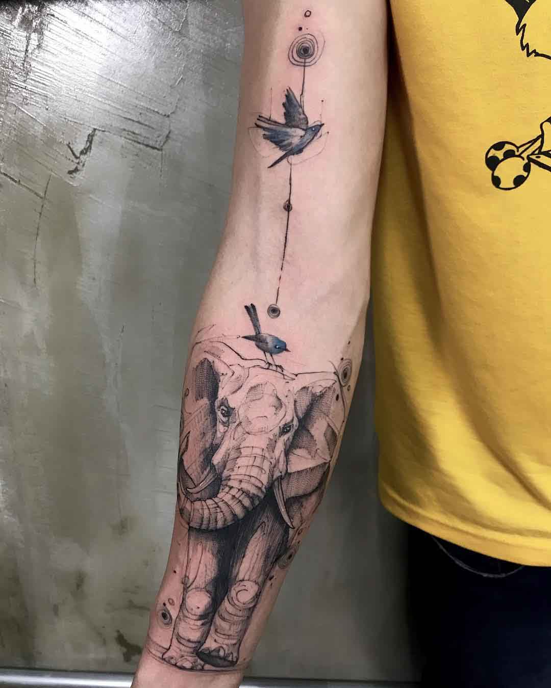 arm tattoo elephant and birds