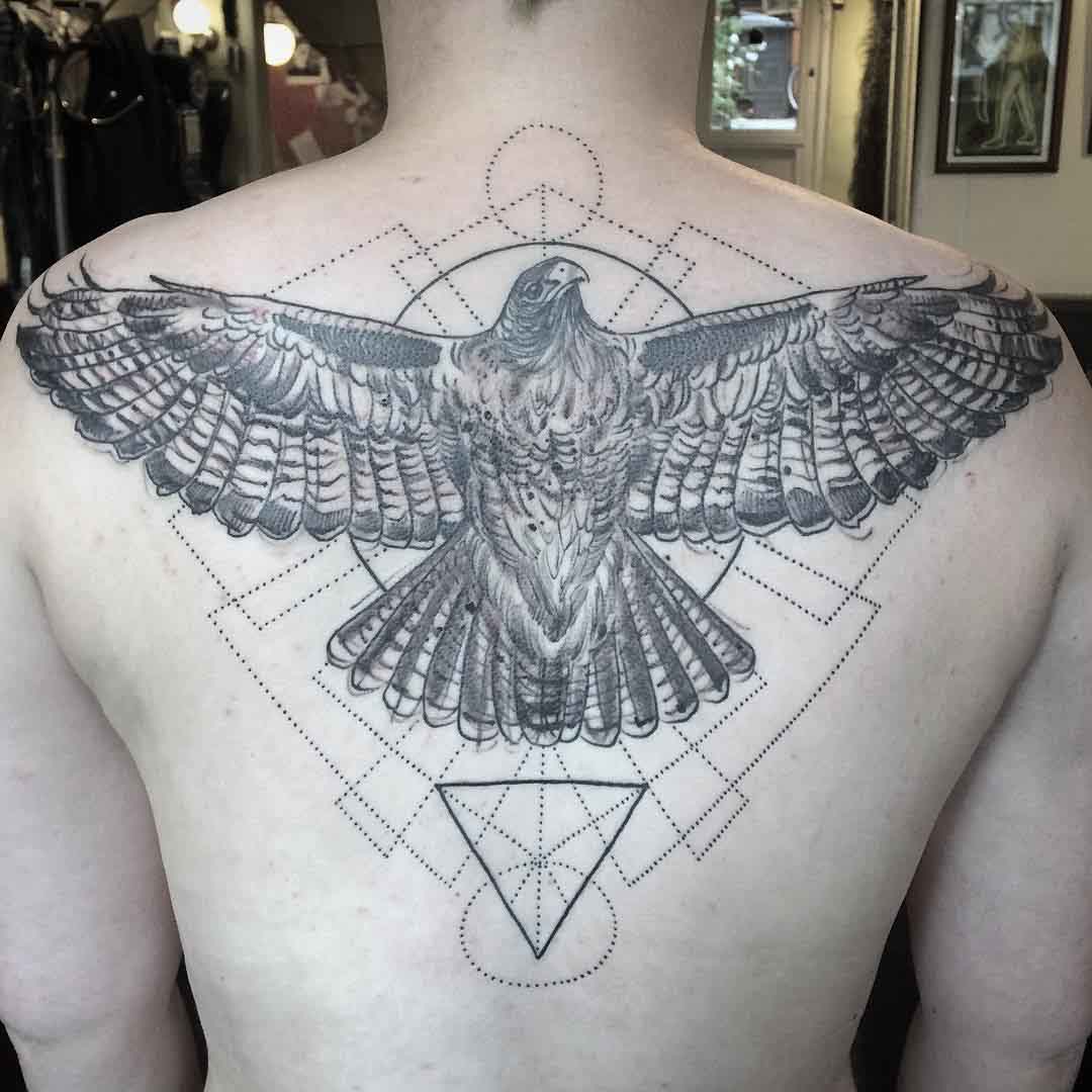 geometric eagle tattoo on back