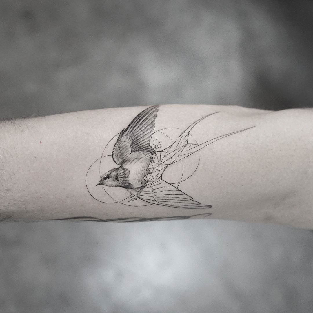 arm tattoo swallow bird