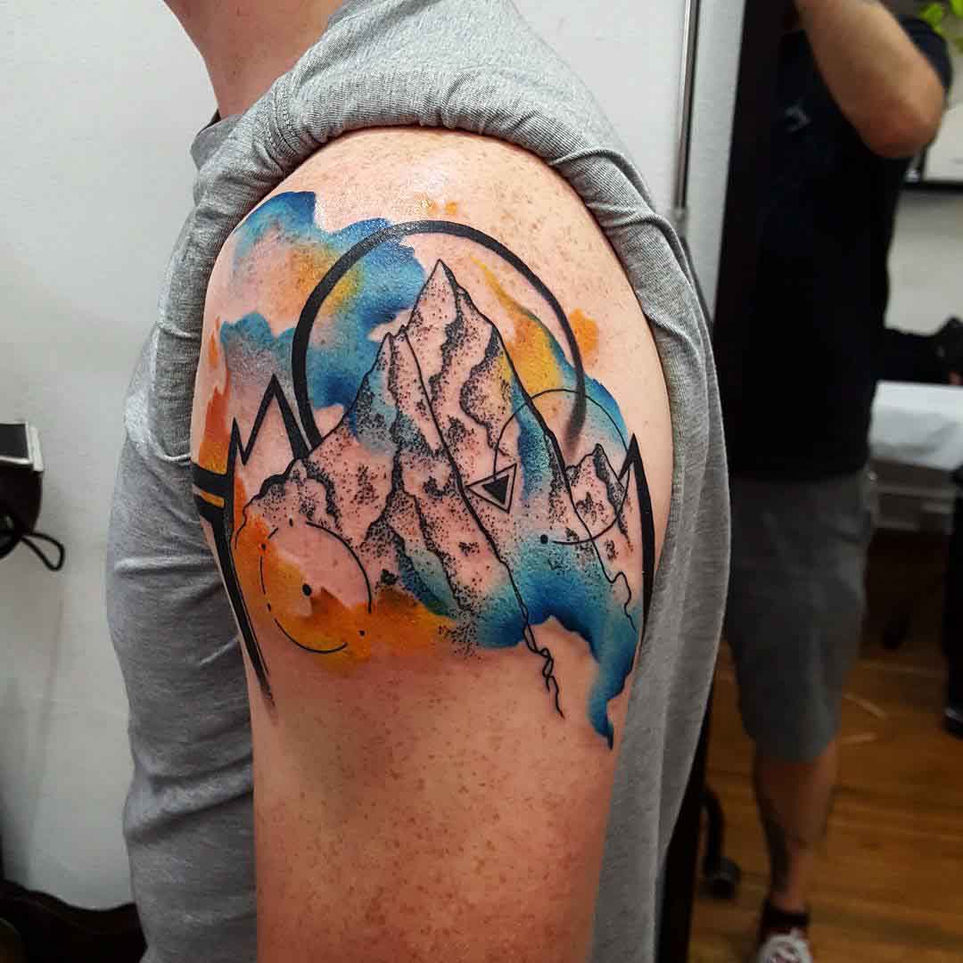 shoulder tattoo mountains