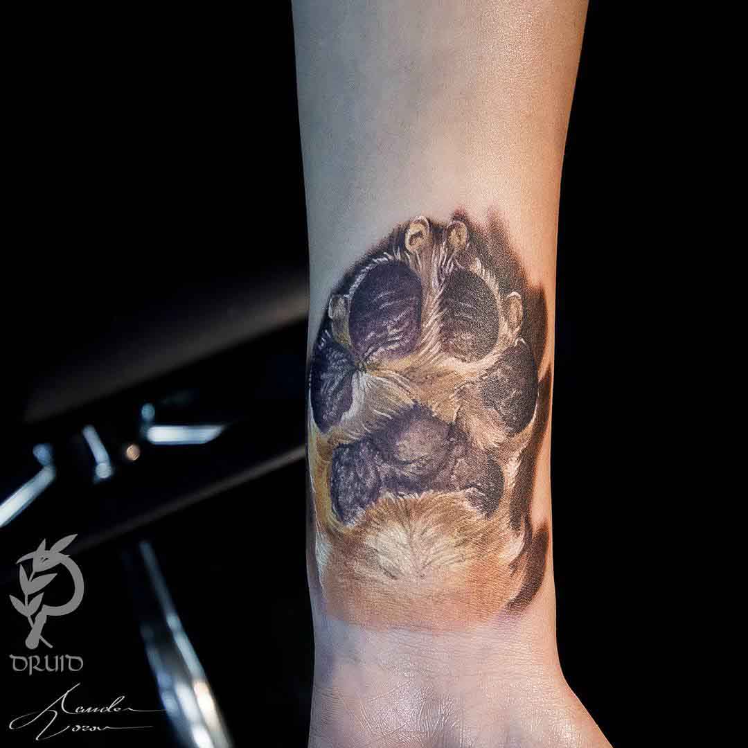 arm tattoo dog paw