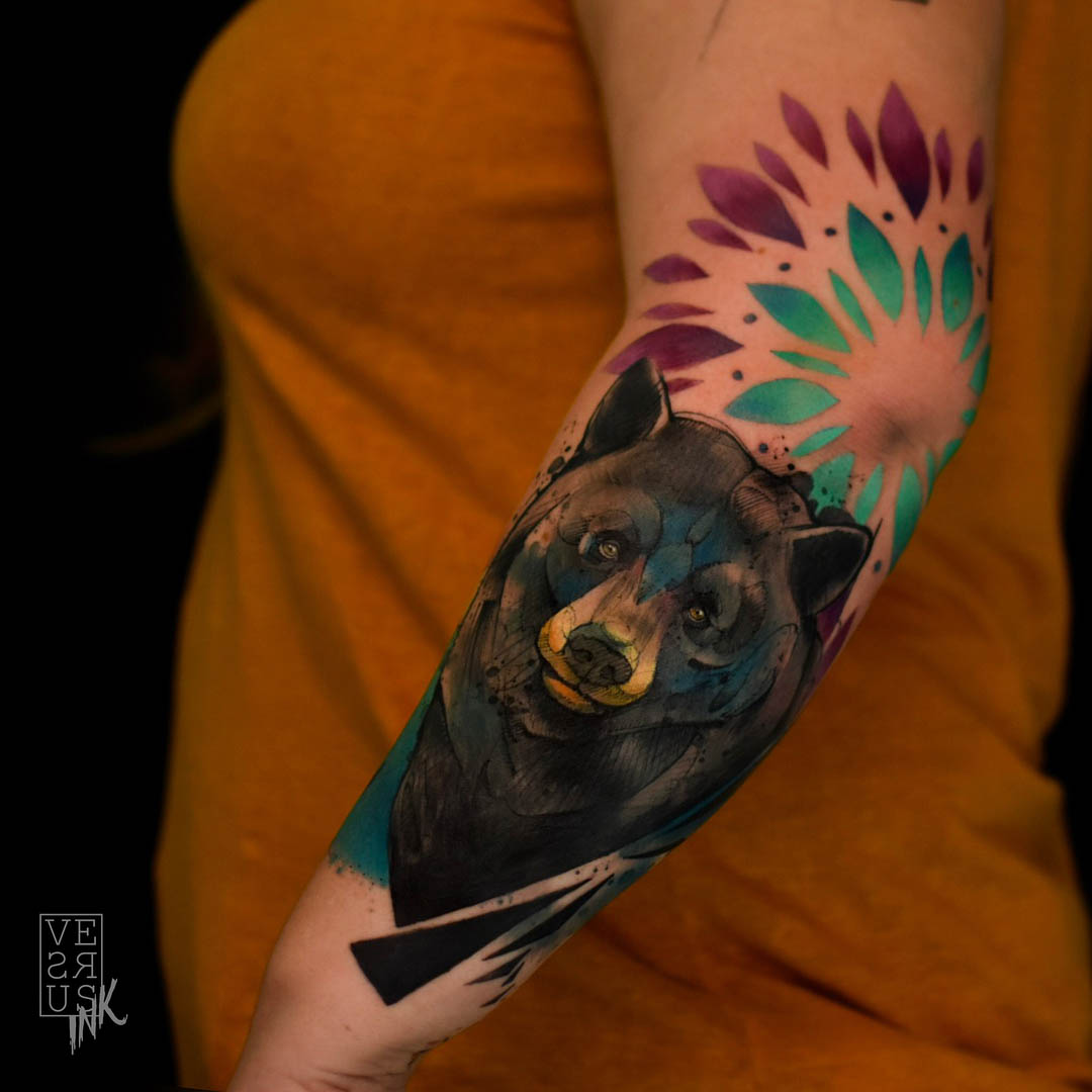 bear tattoo on forearm