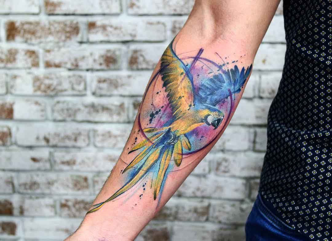 watercolor parrot tattoo on arm