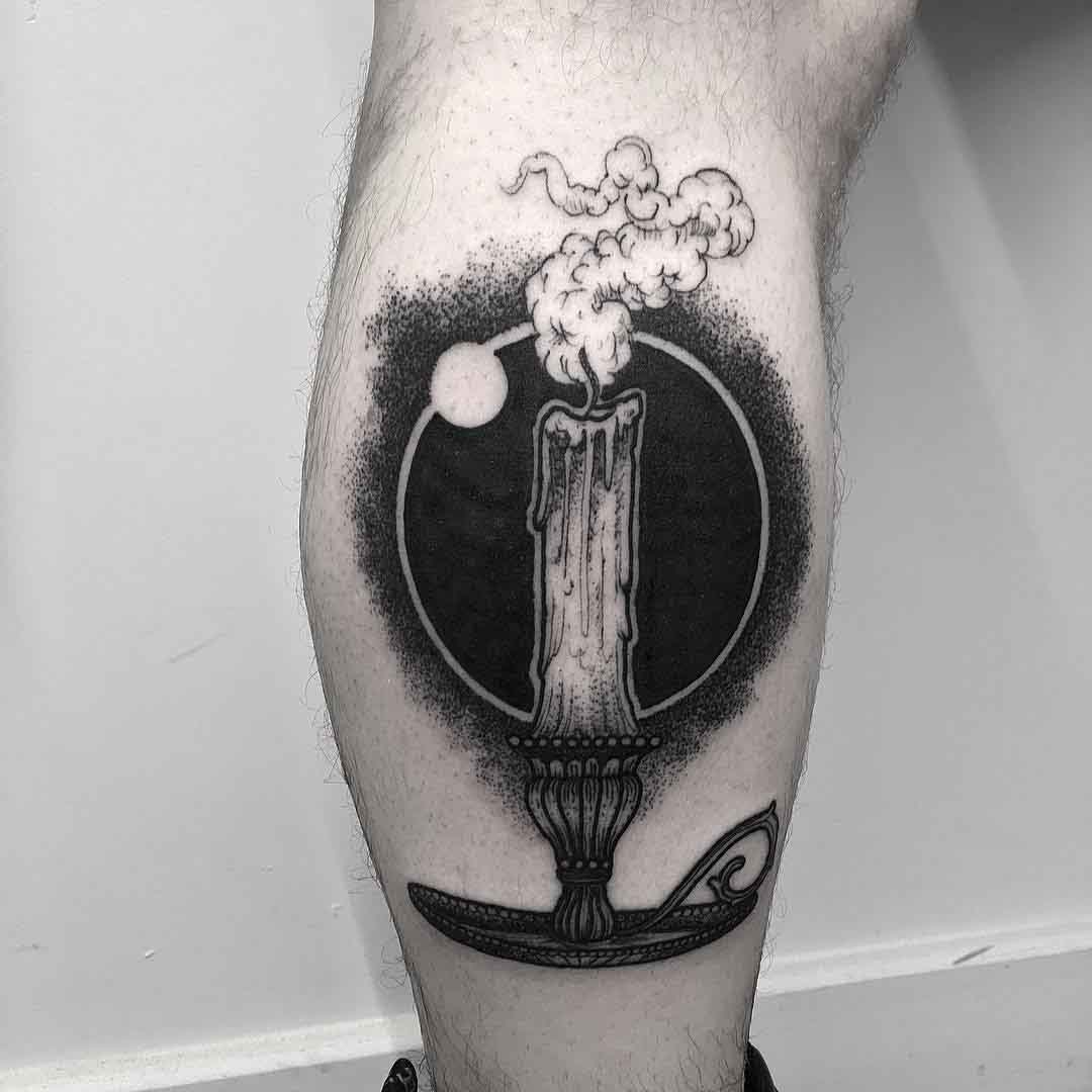 candle tattoo on calf