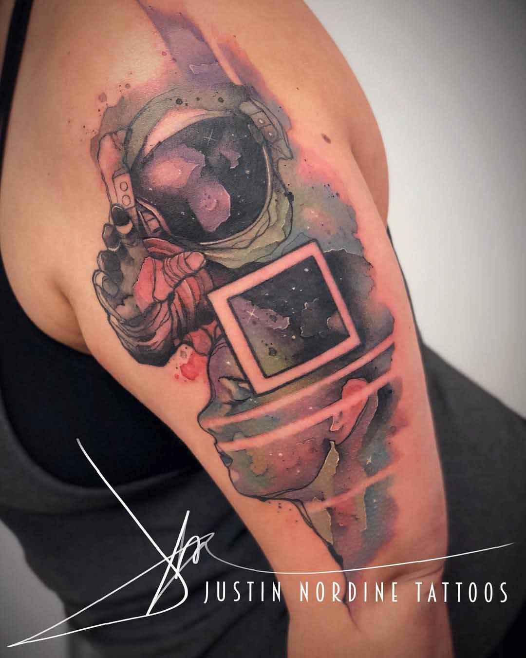 watercolor tattoo astronaut on shoulder