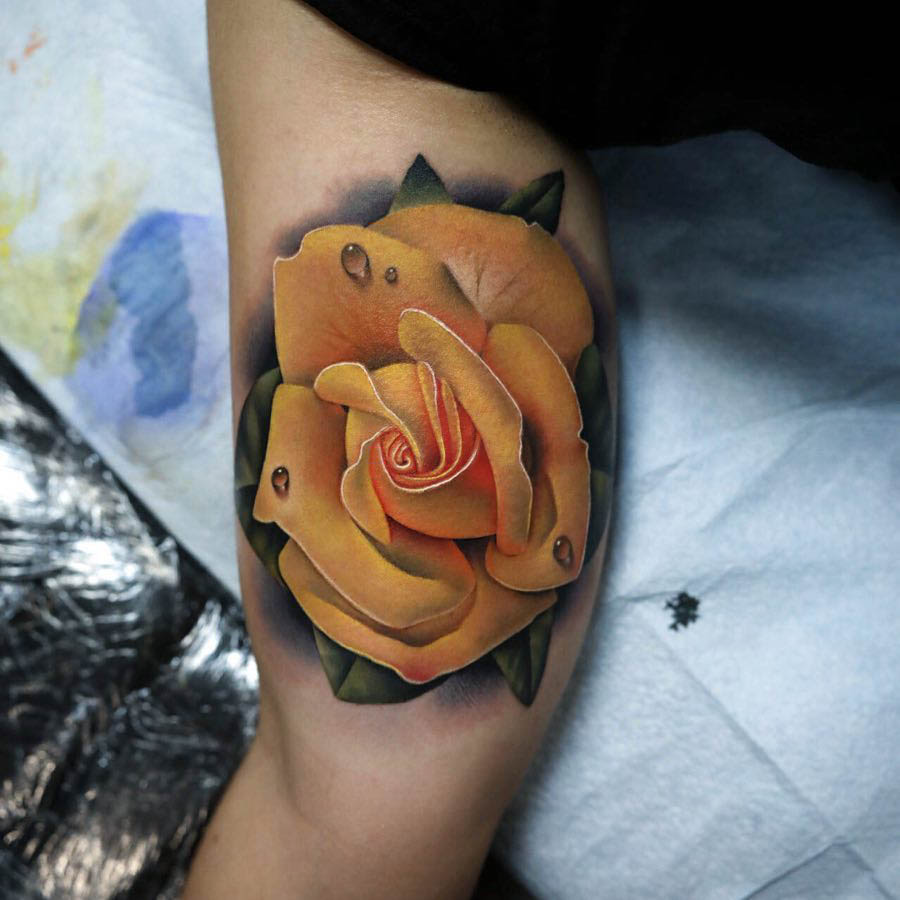 bicep tattoo ellow rose
