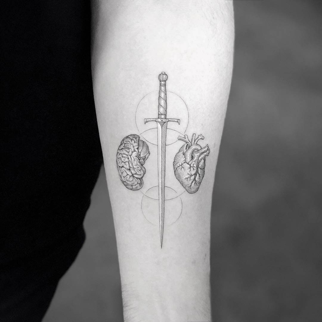 arm tattoo brain sword heart