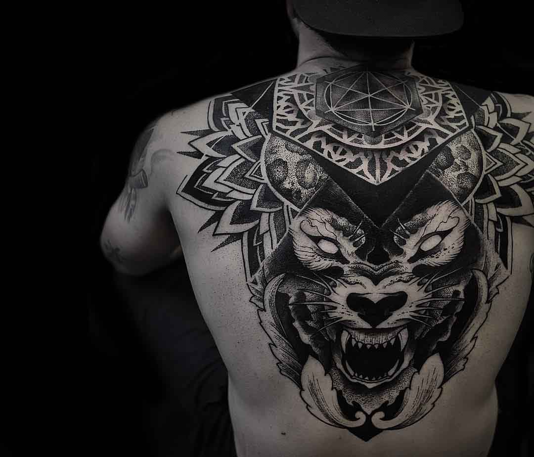 upper back tattoo geometry and wolf