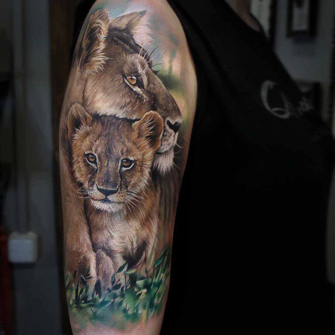 lion tattoo with cub