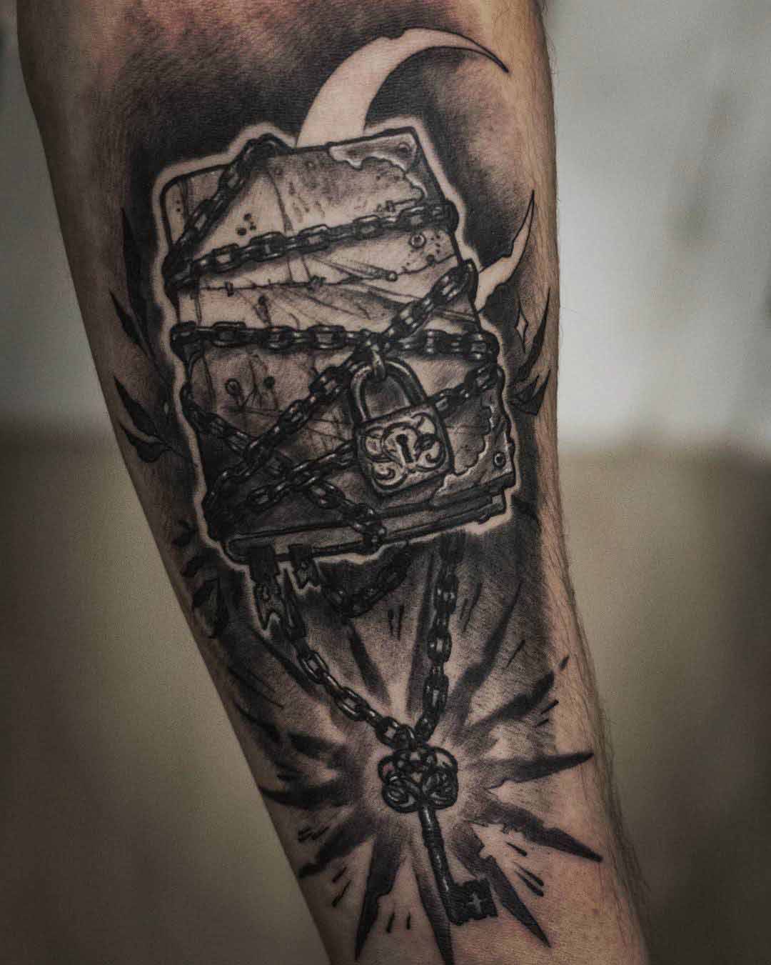 chained book tattoo of magic