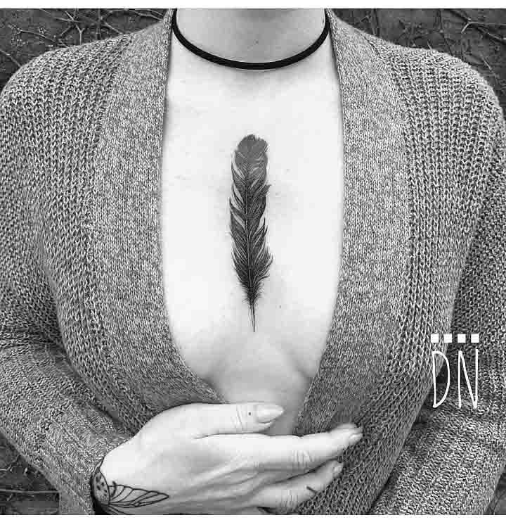 feather tattoo on chest