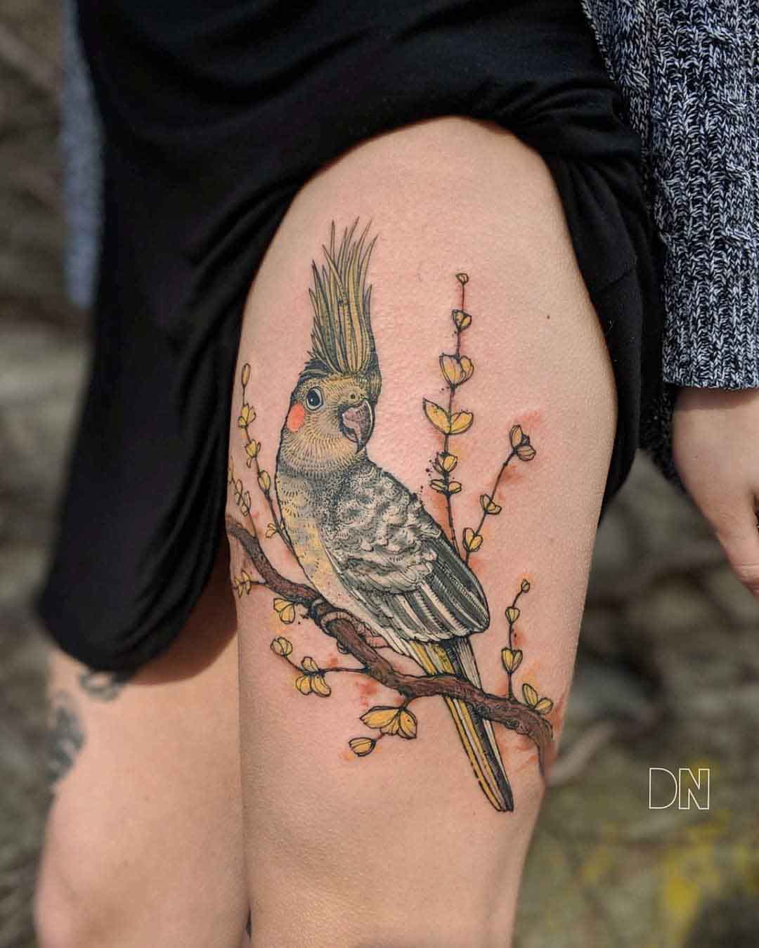 parrot tattoo on thigh