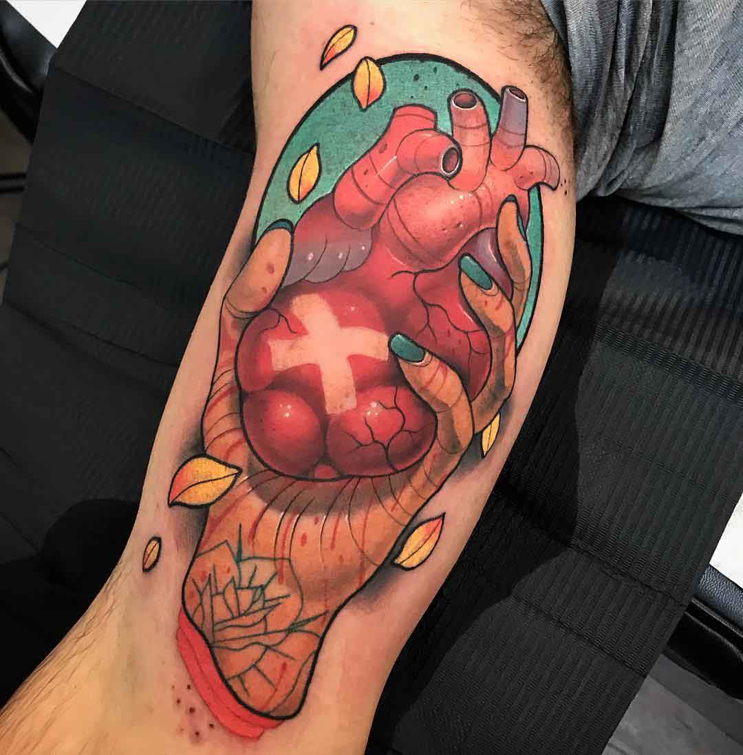 heart tattoo in hand on arm