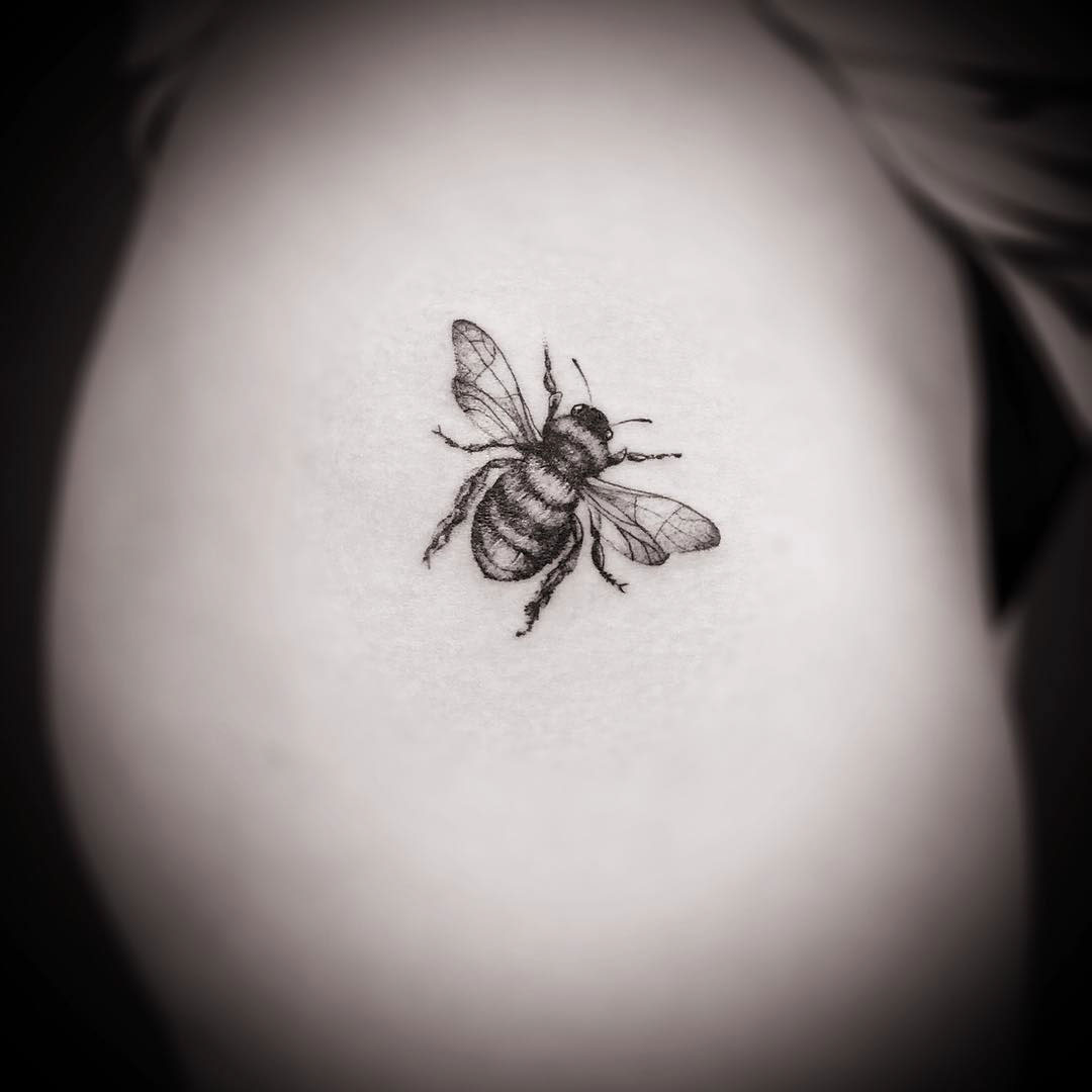 tiny tattoo of a bee