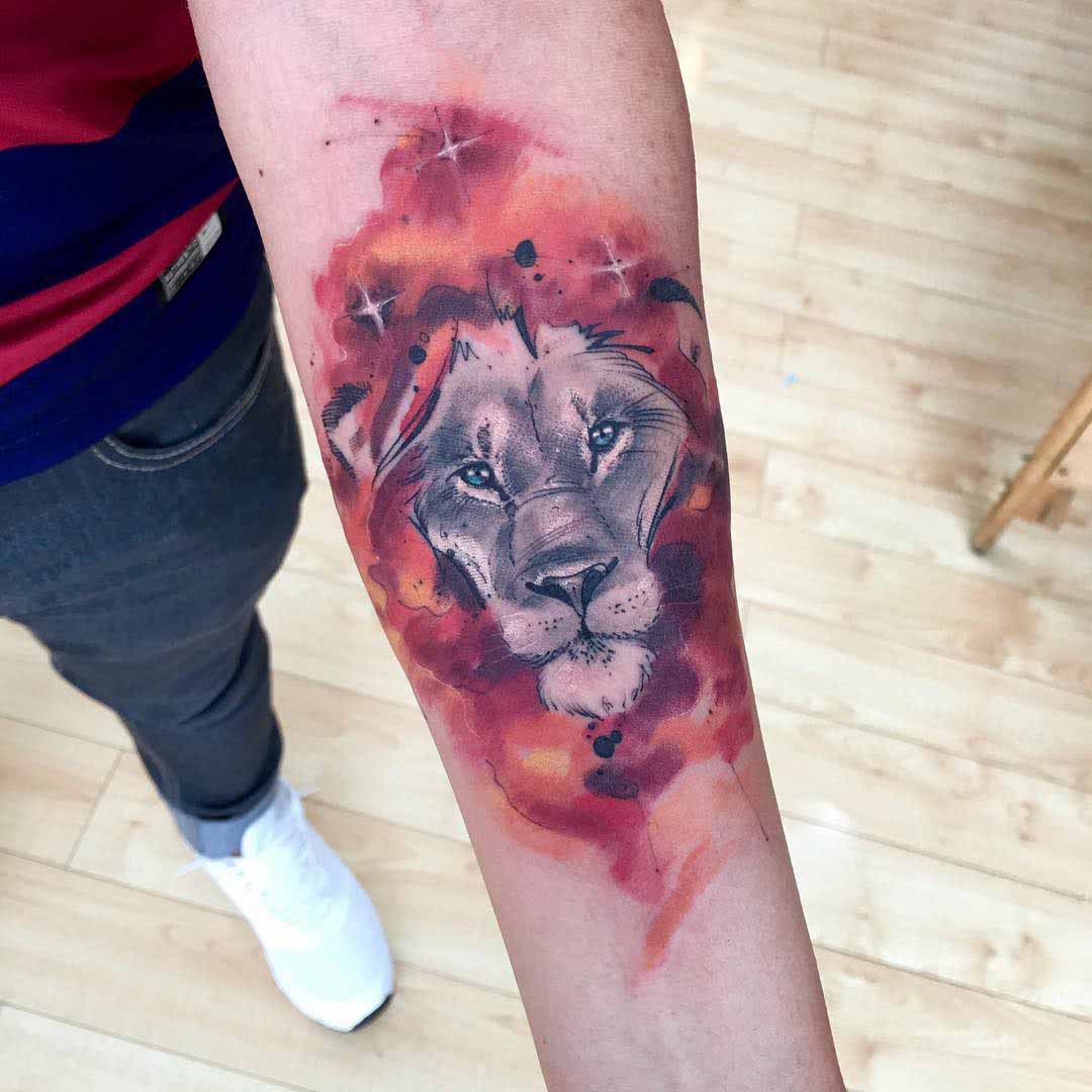 lion tattoo on arm watercolor style