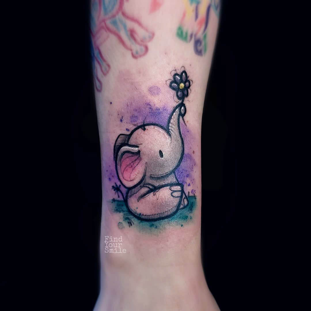 cute small elephant tattoo on arm