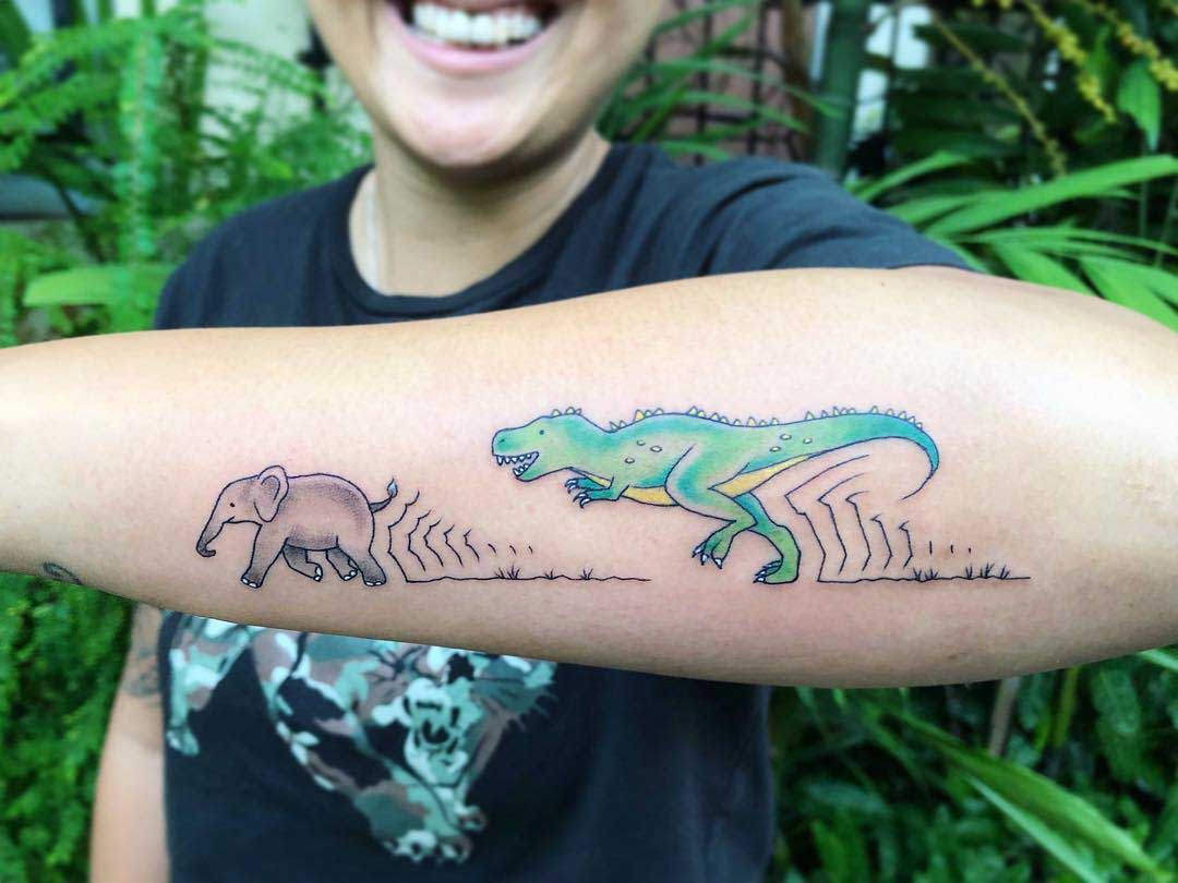 forearm tattoo dinosaur and elephant
