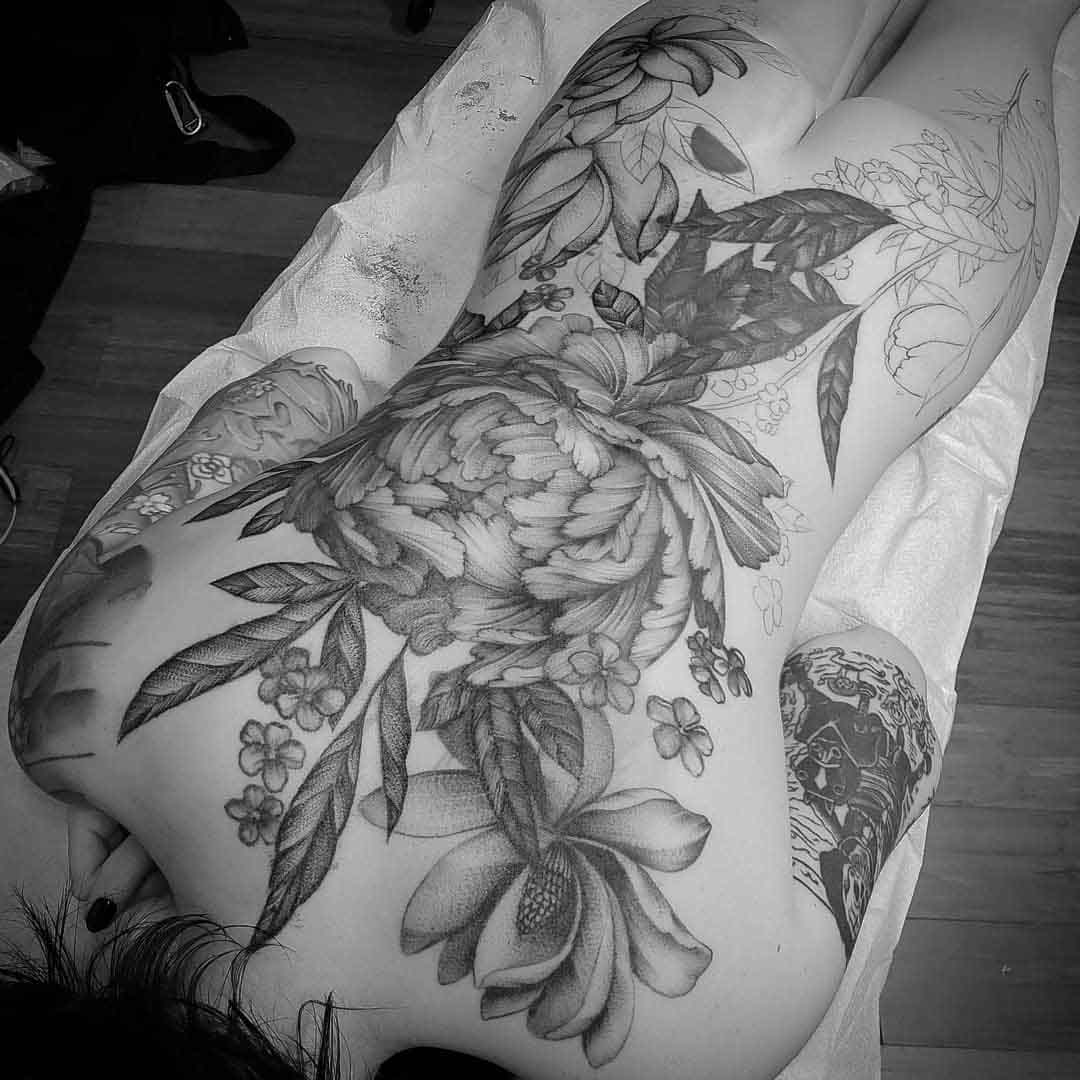 big flowers tattoo on back in progress