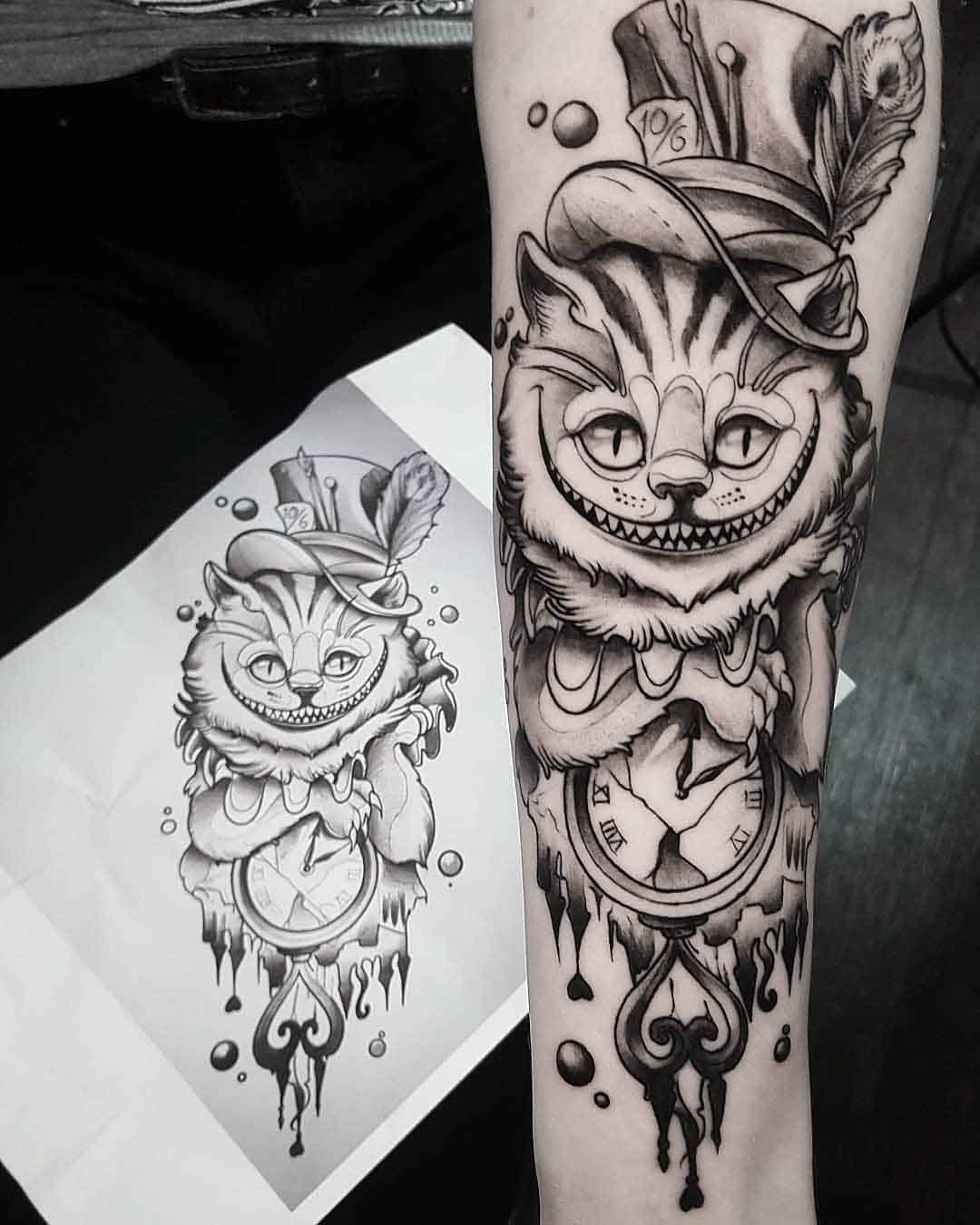 arm tattoo cheshire cat