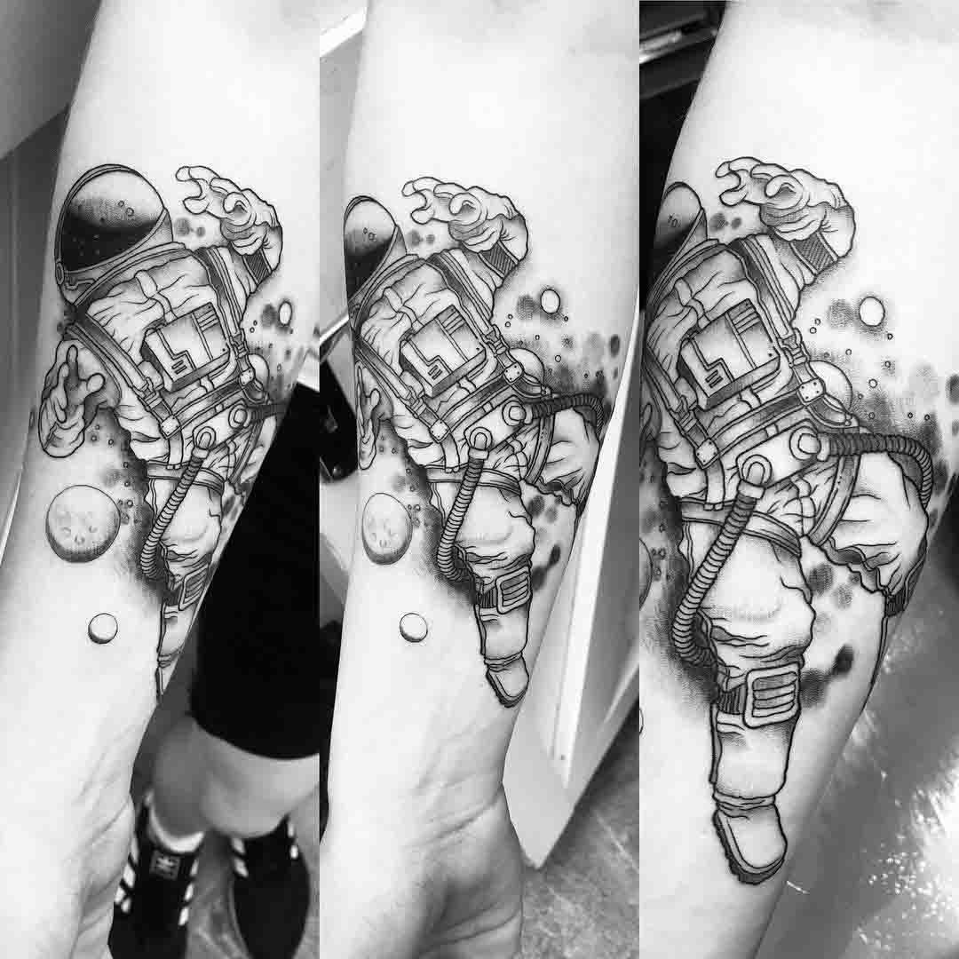 arm tattoo astronaut