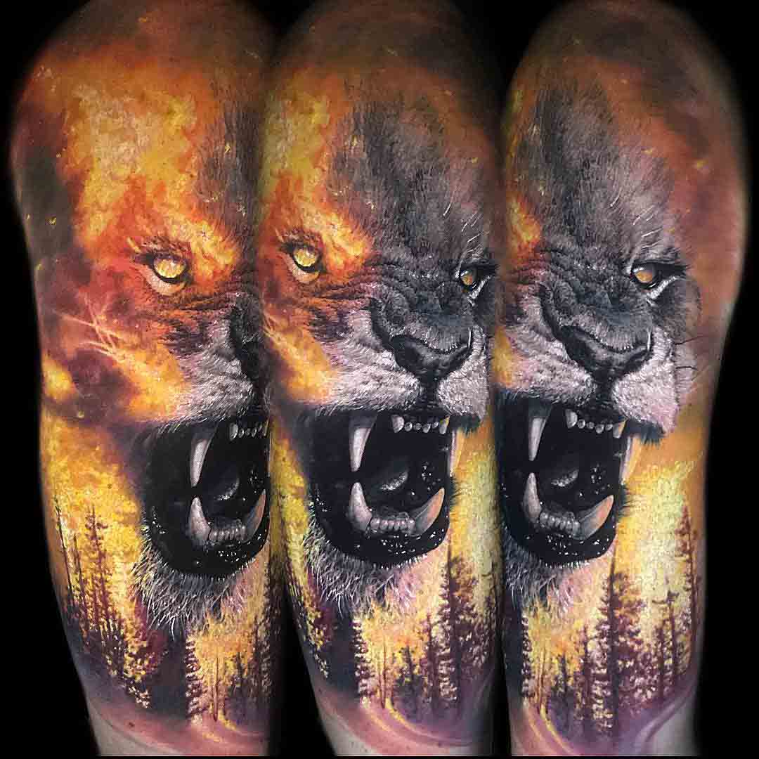 lion tattoo flames on shoulder