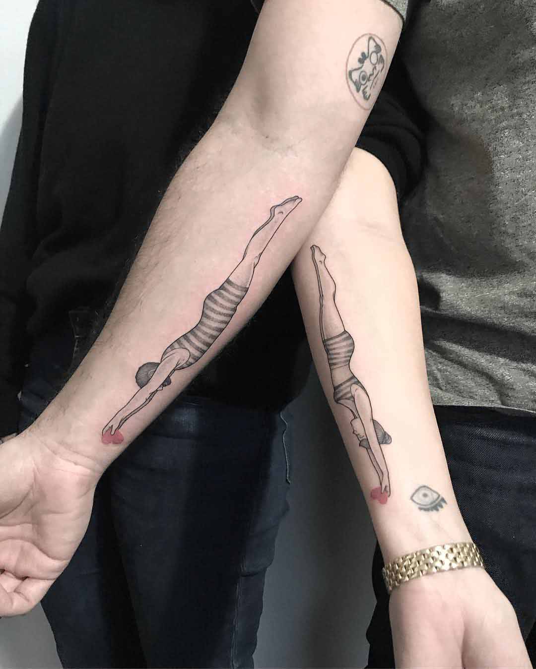 couple tattoo swimmers