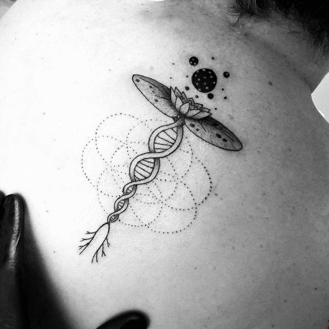 lotus tattoo with spiral roots