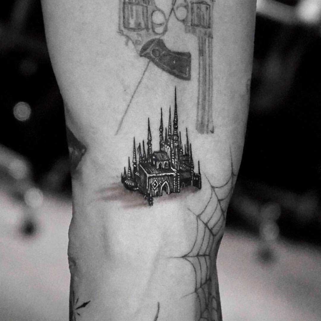 very small castle tattoo