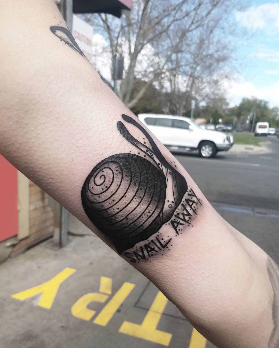 arm snail tattoo