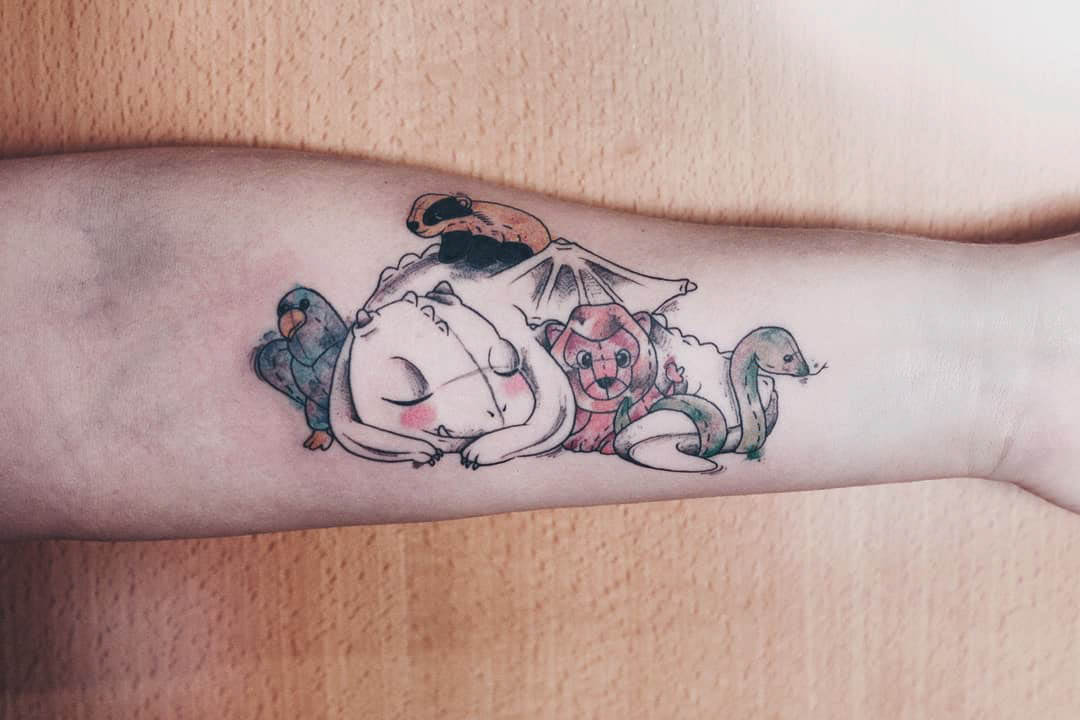 arm tattoo cosy animals