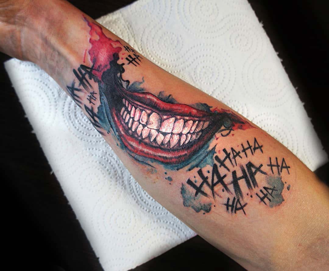 arm tattoo joker smile