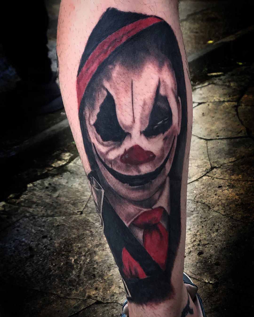 clown tattoo on calf