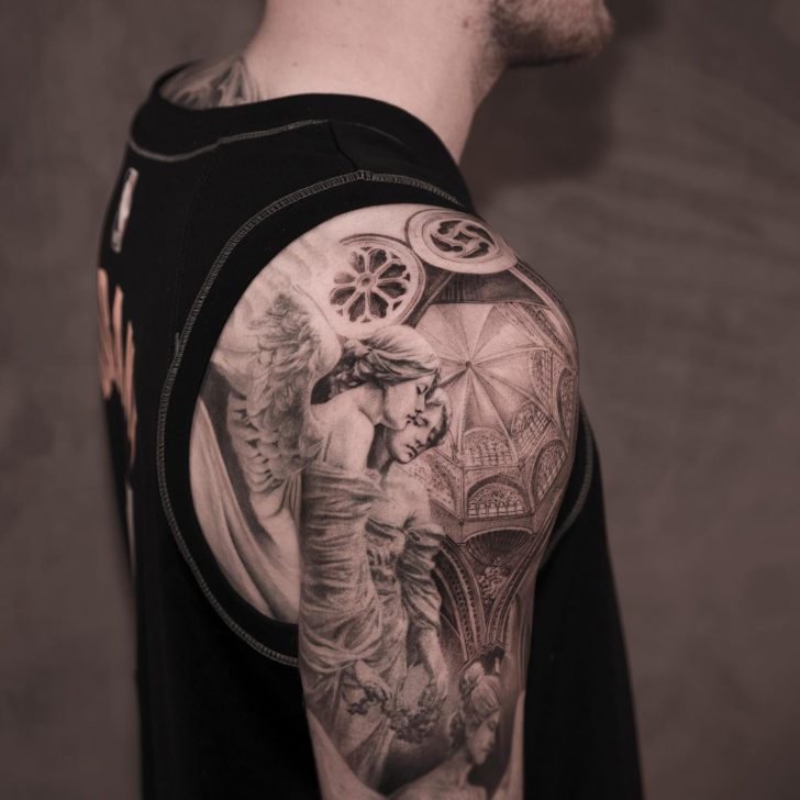black and grey realistic angel and demon tattoo